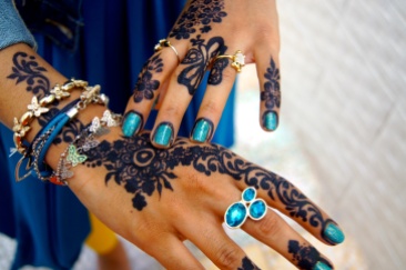 A cousin shows off her henna designs