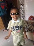 In the USA outfit that I brought him. And upside down sunglasses